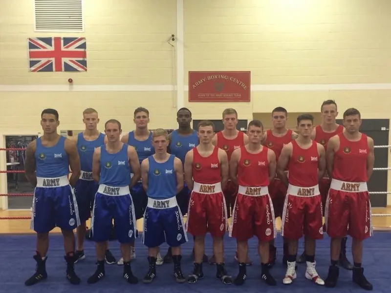 Boxing team line-up in red and blue vests